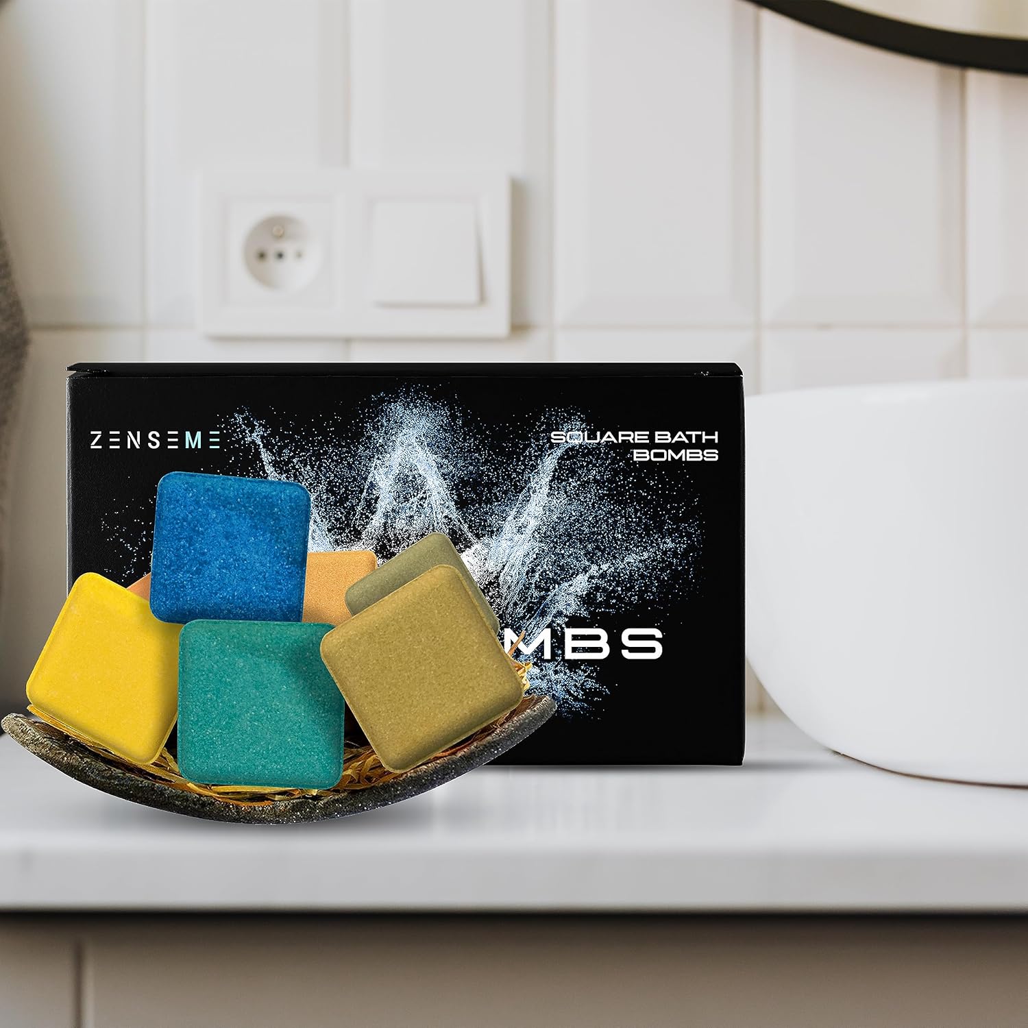 Colorful bath bombs in a dish with ZENSEME packaging on a white surface.